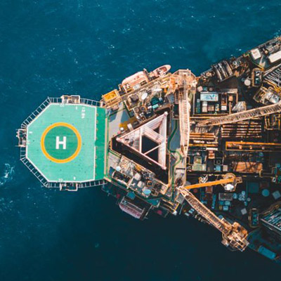 Aerial view of jack up rig with towing vessel during towing operation