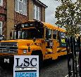 Side of Yellow Bus during a Teesside University open day event