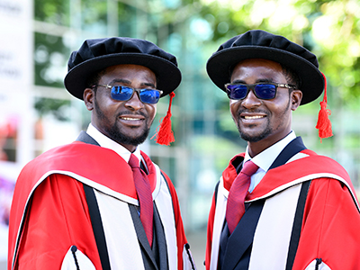 Doctorate milestone shared by twin scholars. Link to Doctorate milestone shared by twin scholars.