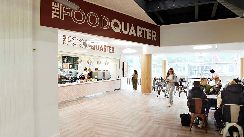 Students sit in The Food Quarter