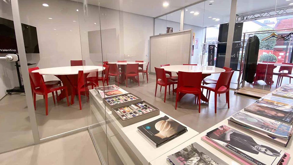 Interior of a Ferrari Fashion School classroom with red chairs