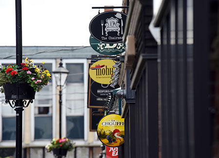 Signs of bars and pubs on Baker and Bedford Street