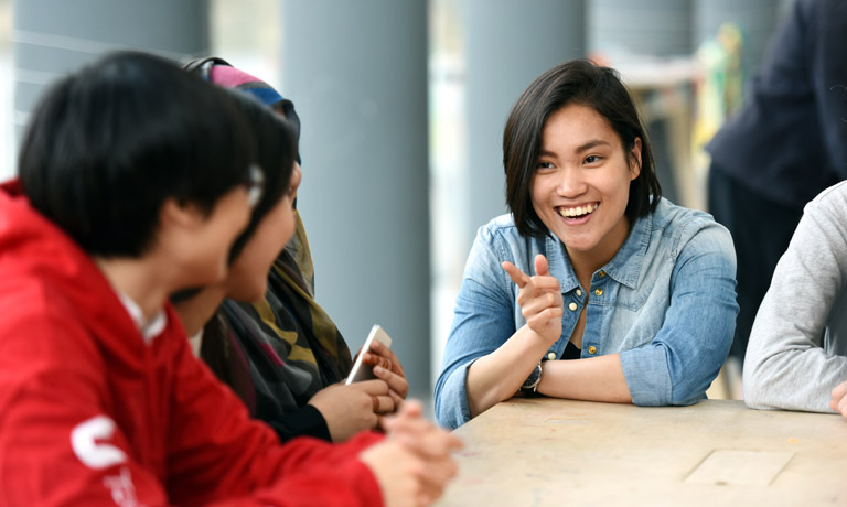 Students meeting and chatting in a supportive environment at Teesside University