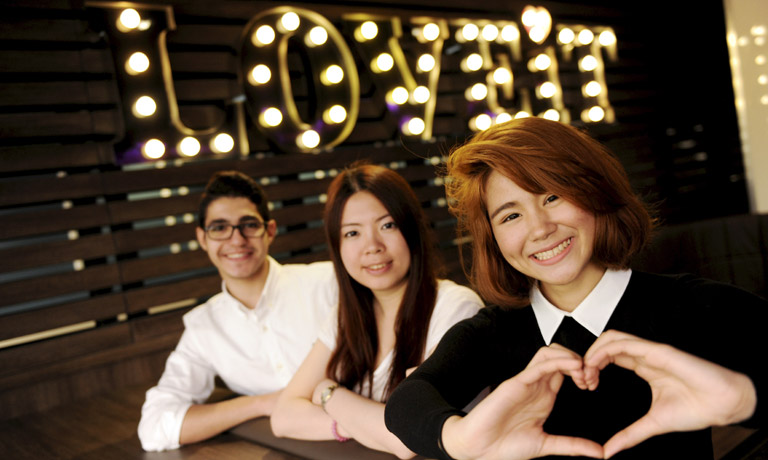 Group of students sitting together in a social setting