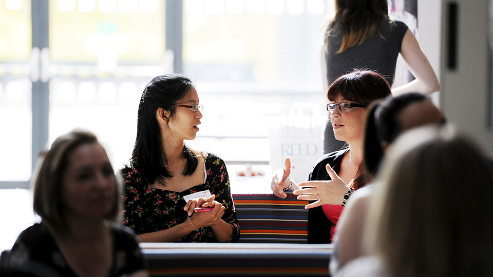Research student discussing her work with a supervisor at Teesside University