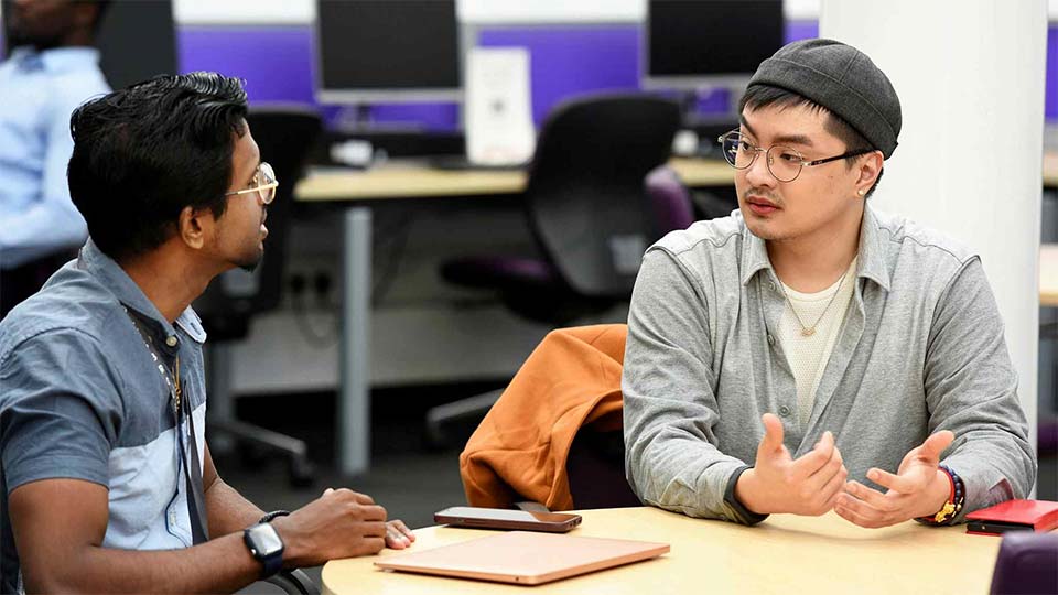 Students sitting and talking together at Teesside University