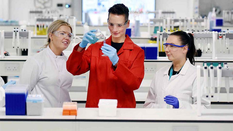 Postgraduate students conducting research in a laboratory at Teesside University