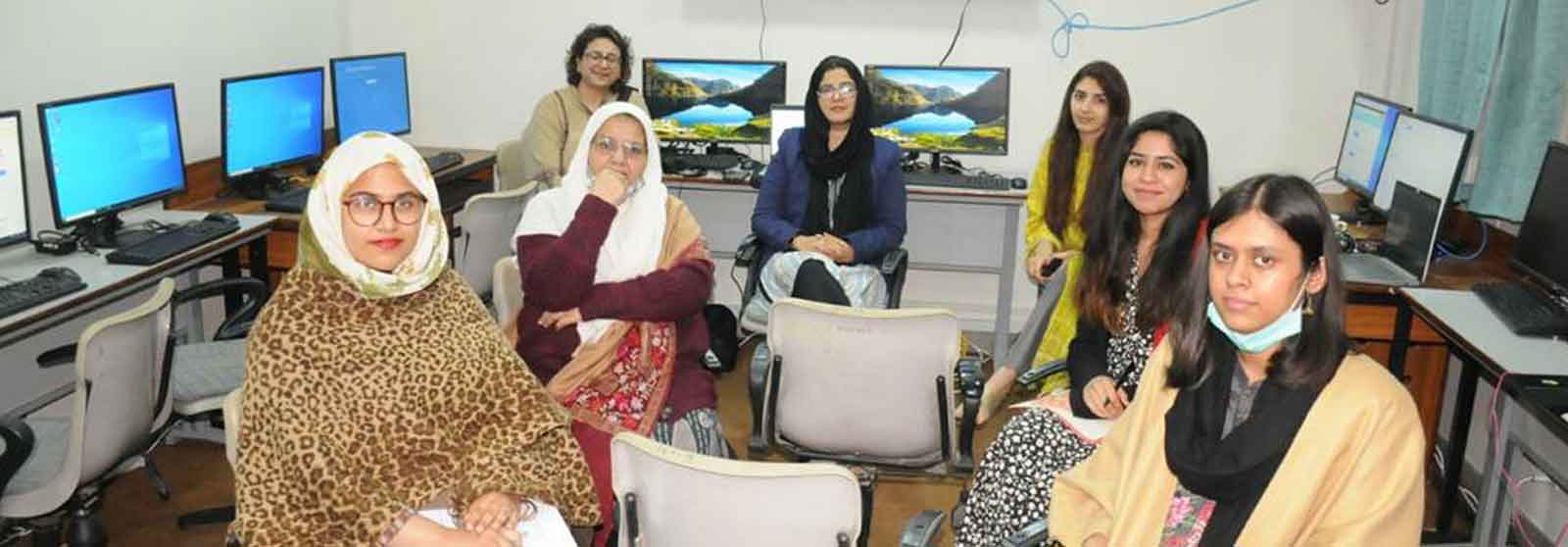 Pakistani women engaged in discussion, representing the voices of South Asian women writers and early career researchers overcoming barriers