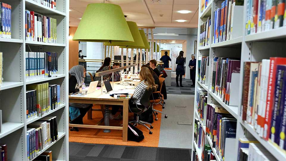 Students studying in the library at Teesside University