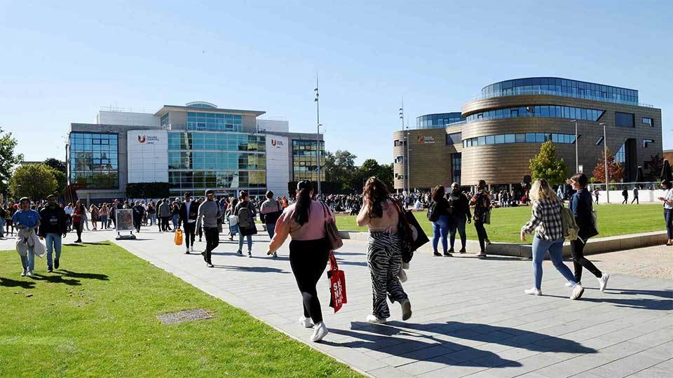 Students walking through Campus Heart at Teesside University