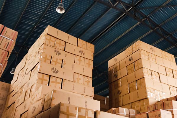 Pallets of boxes stored in a warehouse