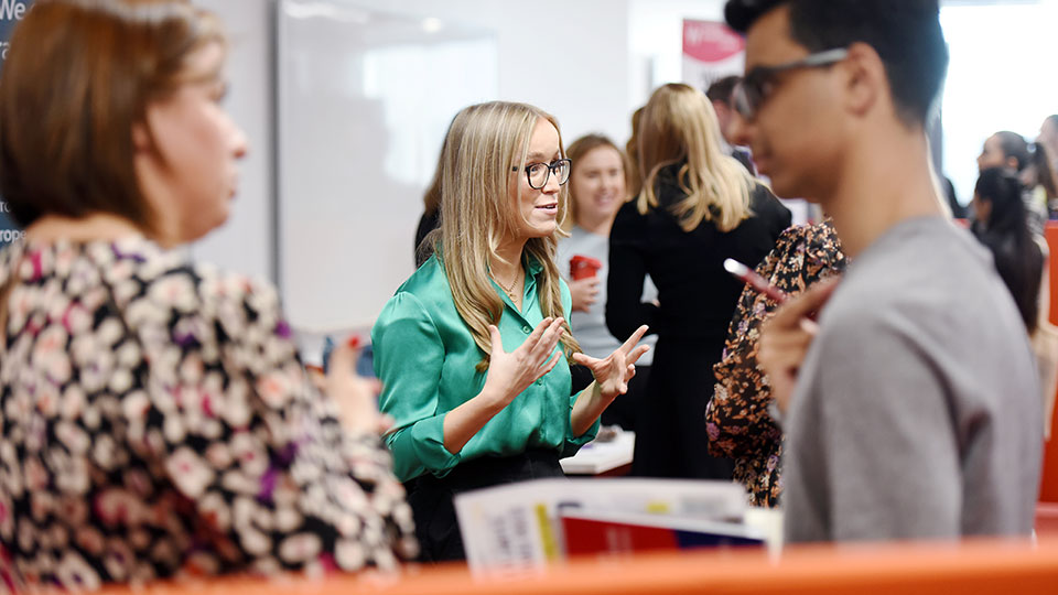 Teesside University alumni engaging in conversation at an alumni event