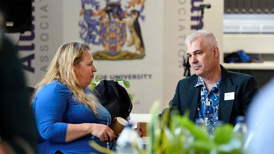 Teesside University alumni engaging in conversation at an alumni event