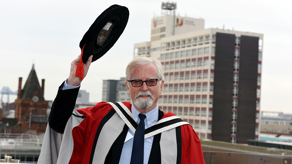 Honorary graduate in academic gown and cap at Teesside University.