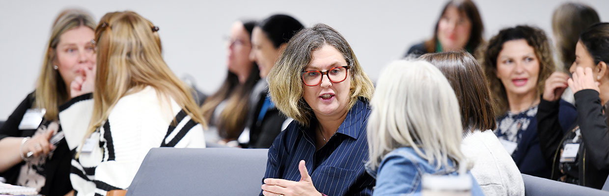 People engaged in discussion, representing collaboration in the public or government sector.