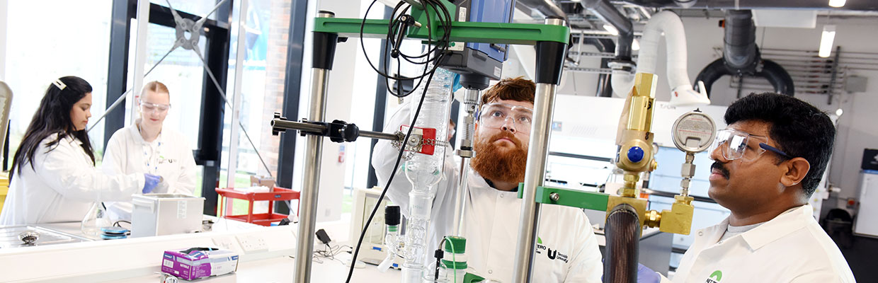 Staff and students working together in a NetZero research lab at Teesside University