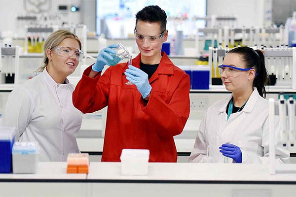 Postgraduate students conducting research in a laboratory at Teesside University