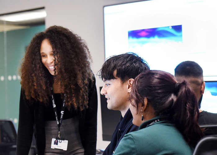 Students and staff working together in a lab at Teesside University London